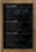 An image of the Foxtail Coffee menu containing cold brew options, fresh brew options, teas, and other specialty drinks. The menu is white text on a black background with a wooden frame around it.